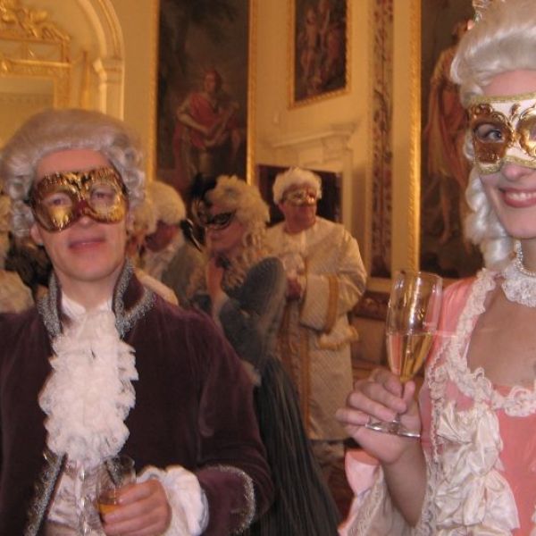 Mingling with the guests at Danson's masquerade ball